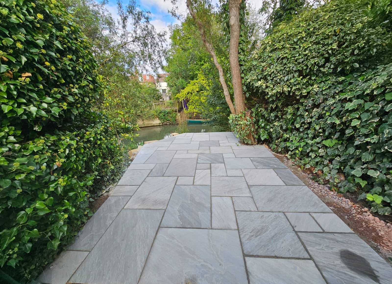sandstone paving installation next to river